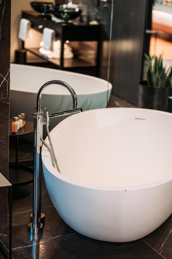 Do & Co Hotel Muenchen Exterior photo A freestanding bathtub